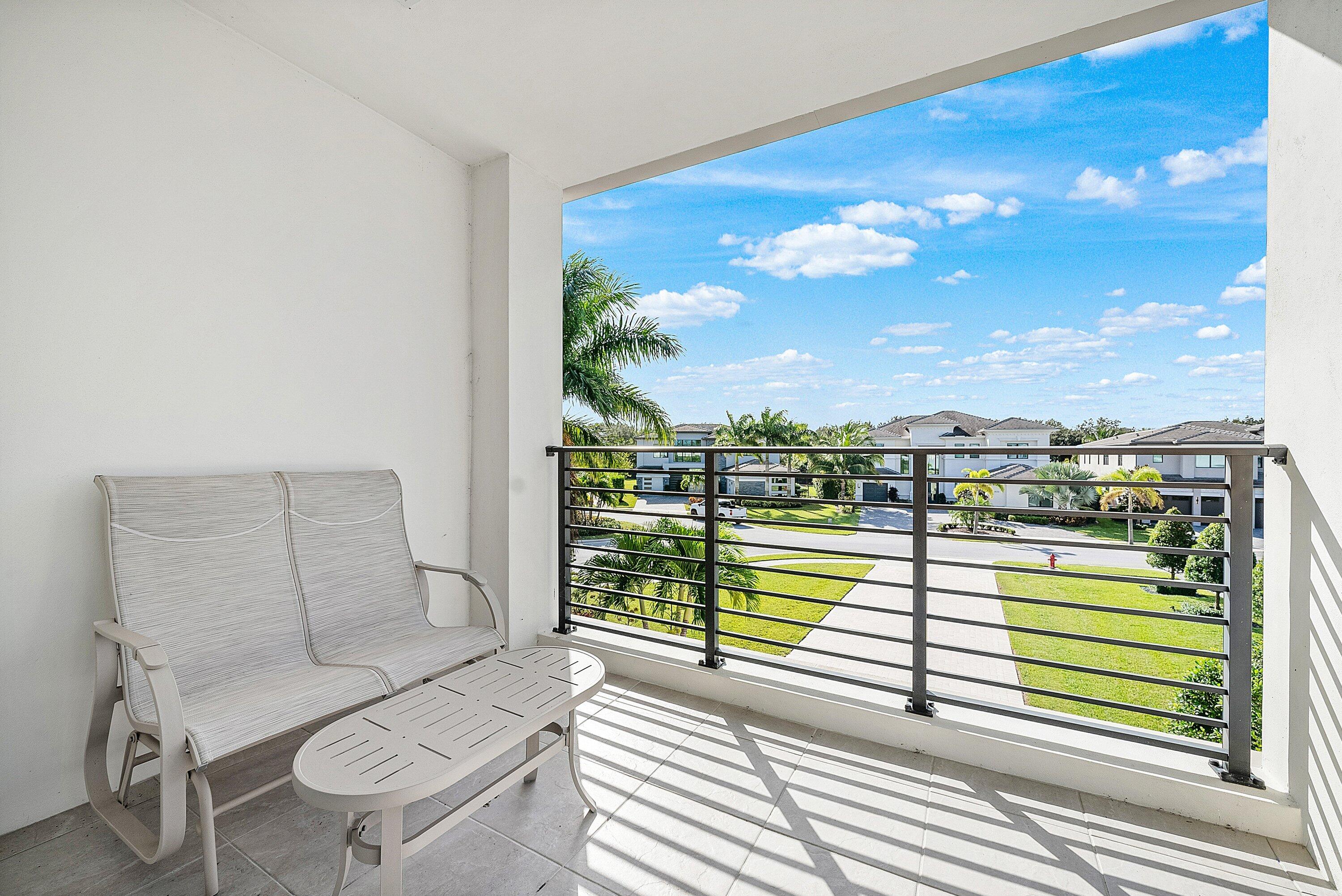 9569 Vescovato Way Boca Raton, FL 33496 - Photo 45 of 98 a view of a balcony with chair and a potted plant
