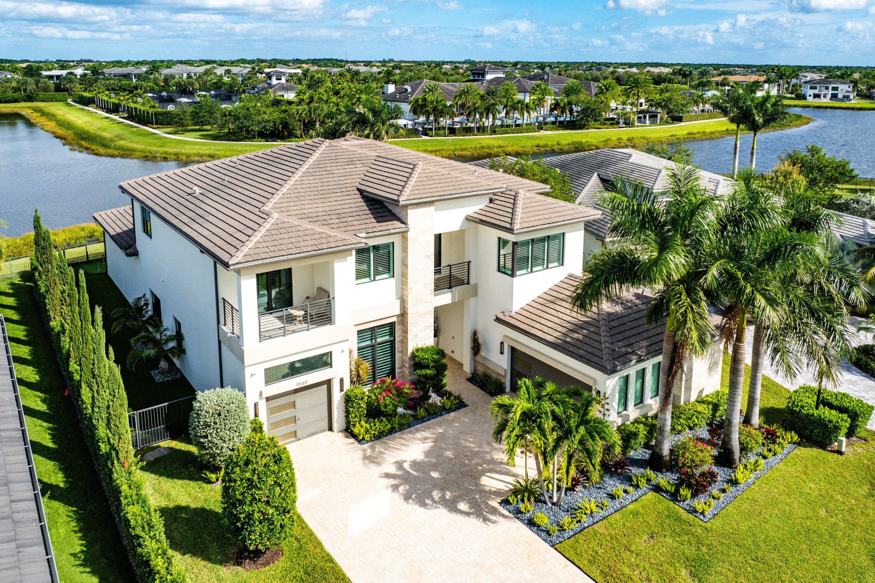 9569 Vescovato Way Boca Raton, FL 33496 - Photo 54 of 98 an aerial view of a house with a garden