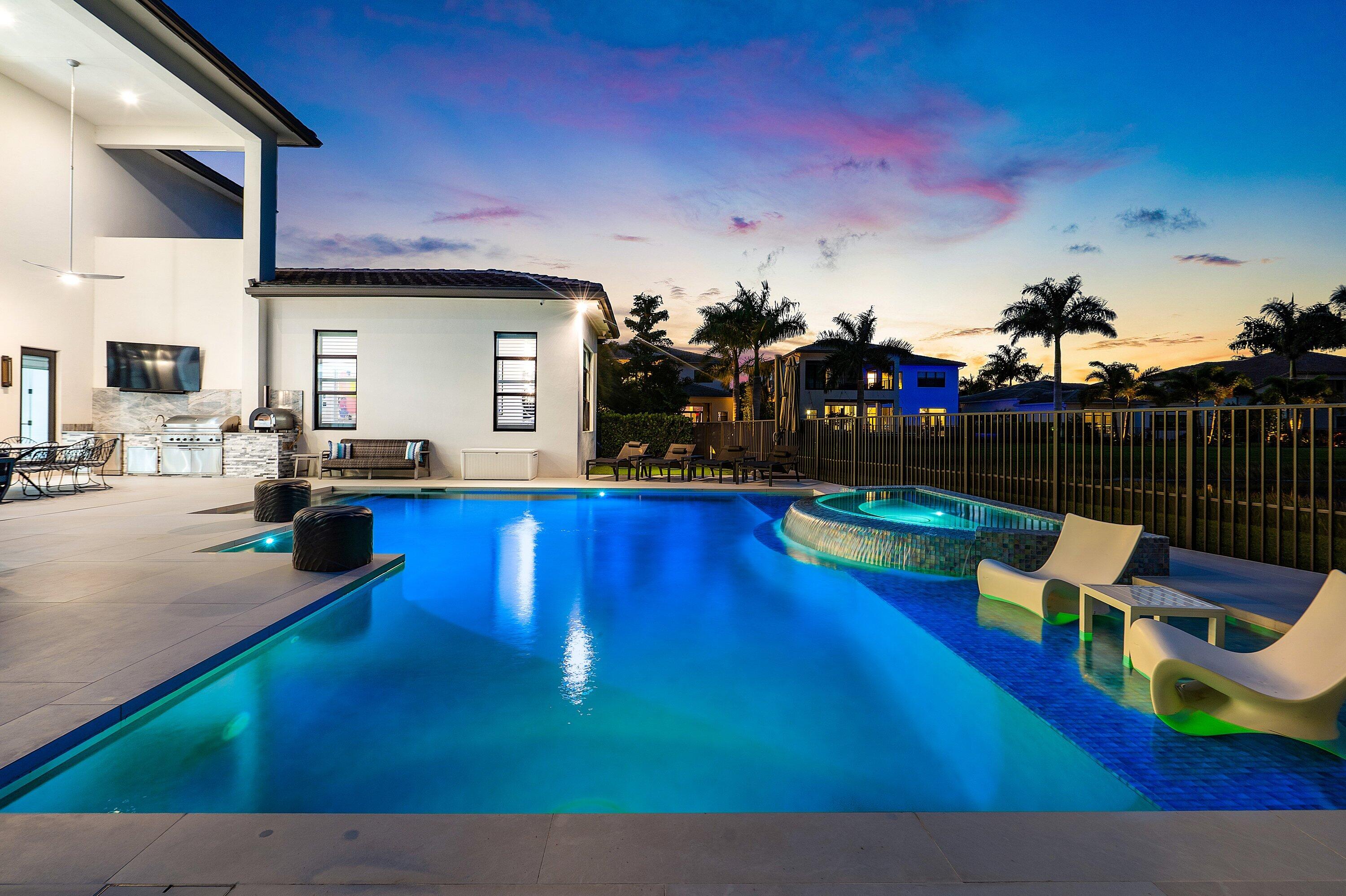 9569 Vescovato Way Boca Raton, FL 33496 - Photo 74 of 98 a swimming pool with outdoor seating