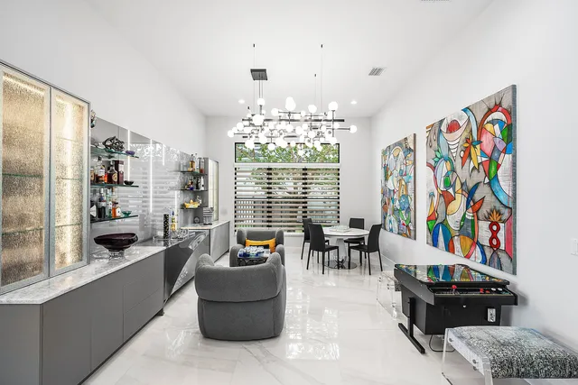 a large kitchen with a table and chairs