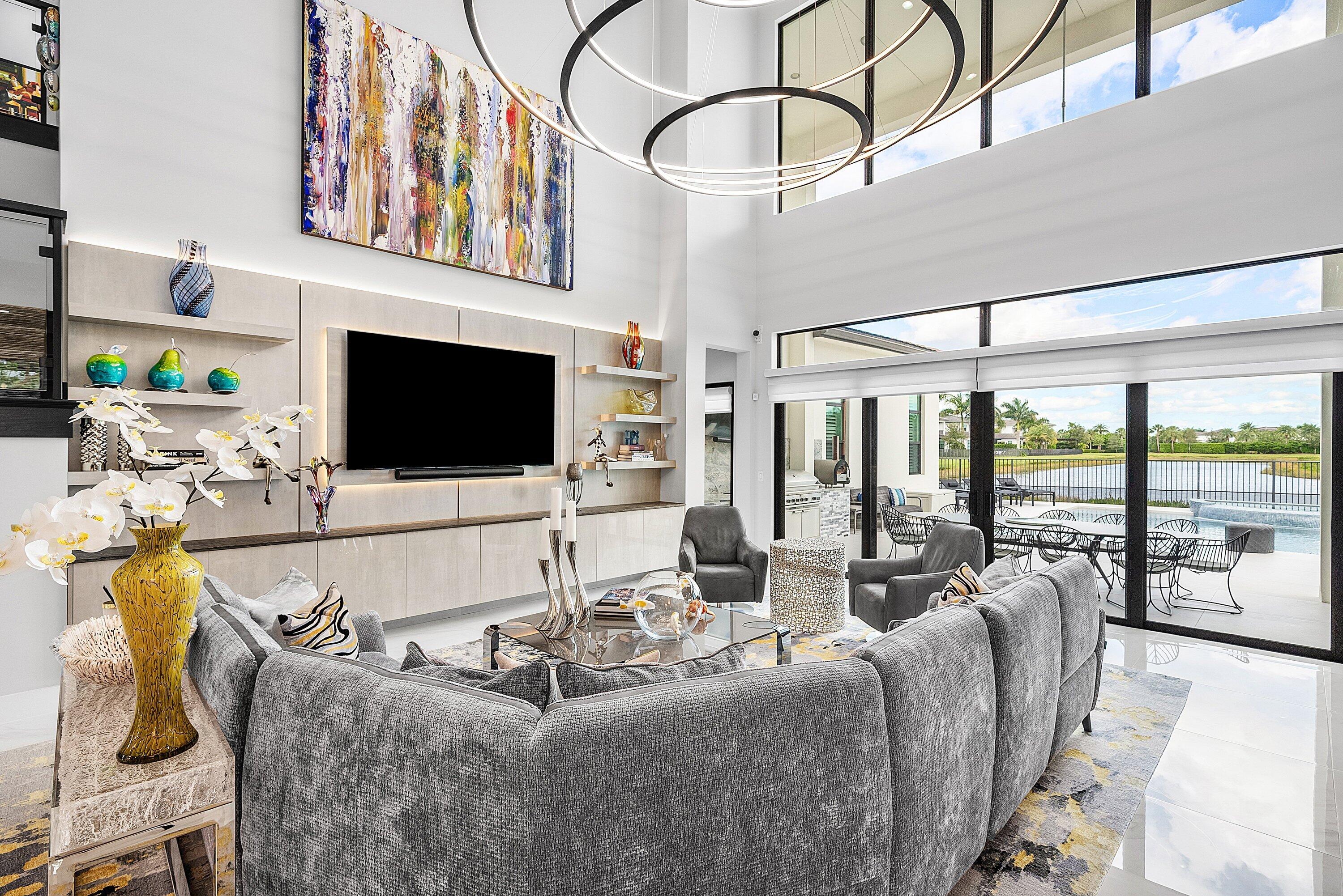 9569 Vescovato Way Boca Raton, FL 33496 - Photo 9 of 98 a living room with fireplace furniture and a flat screen tv