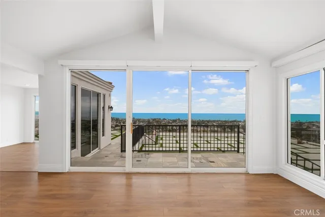 a view of an empty room with a balcony