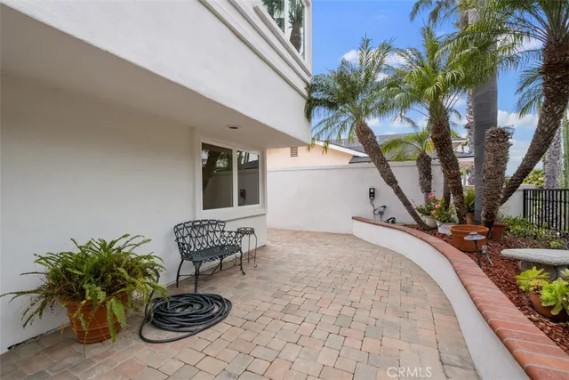a view of empty room with wooden floor and fireplace