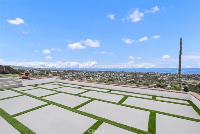 an empty room with floor to ceiling window and fireplace