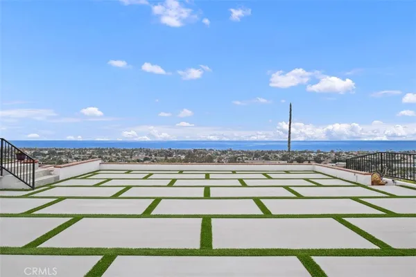 a view of a house with a swimming pool and a chair