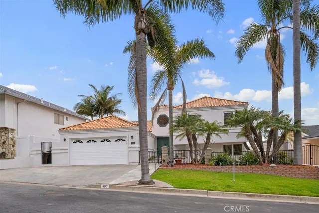 a view of a house with a swimming pool and a chair