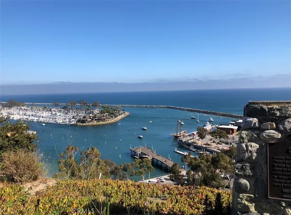 a kitchen with stainless steel appliances granite countertop wooden cabinets sink and stove top oven