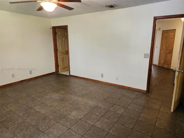 an empty room with a bathroom