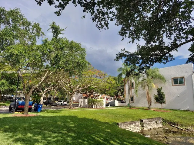 front view of a building with a garden