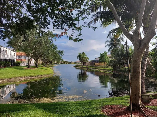 a view of a lake with a yard