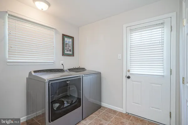 a utility room with washer and dryer