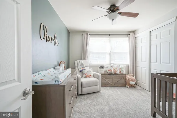 a bedroom with furniture and a window