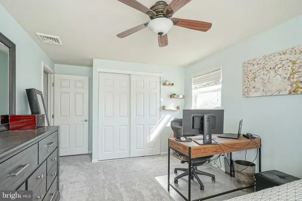 a workspace with furniture and window