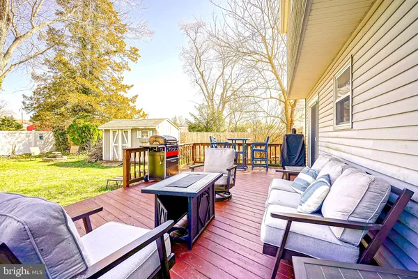 a view of a swimming pool with lounge chairs in patio
