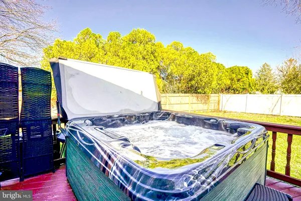 a view of swimming pool with a lounge chairs