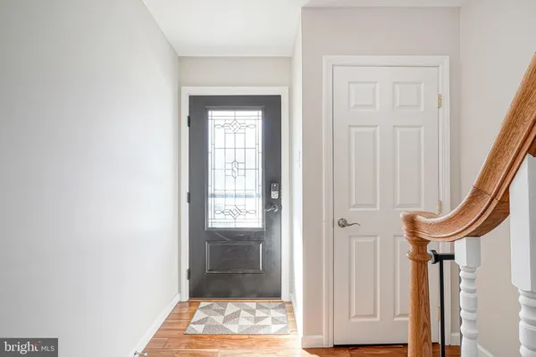 a view of a hallway with wooden door