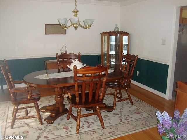 11700 Beach Road Chesterfield, VA 23832 - Photo 8 of 24 a view of a dining room with furniture and wooden floor