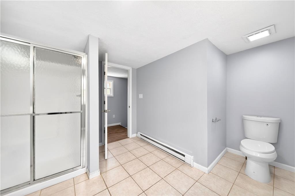 93 Old 51 Road Perryopolis, PA 15473 - Photo 22 of 44 a bathroom with a toilet and a shower