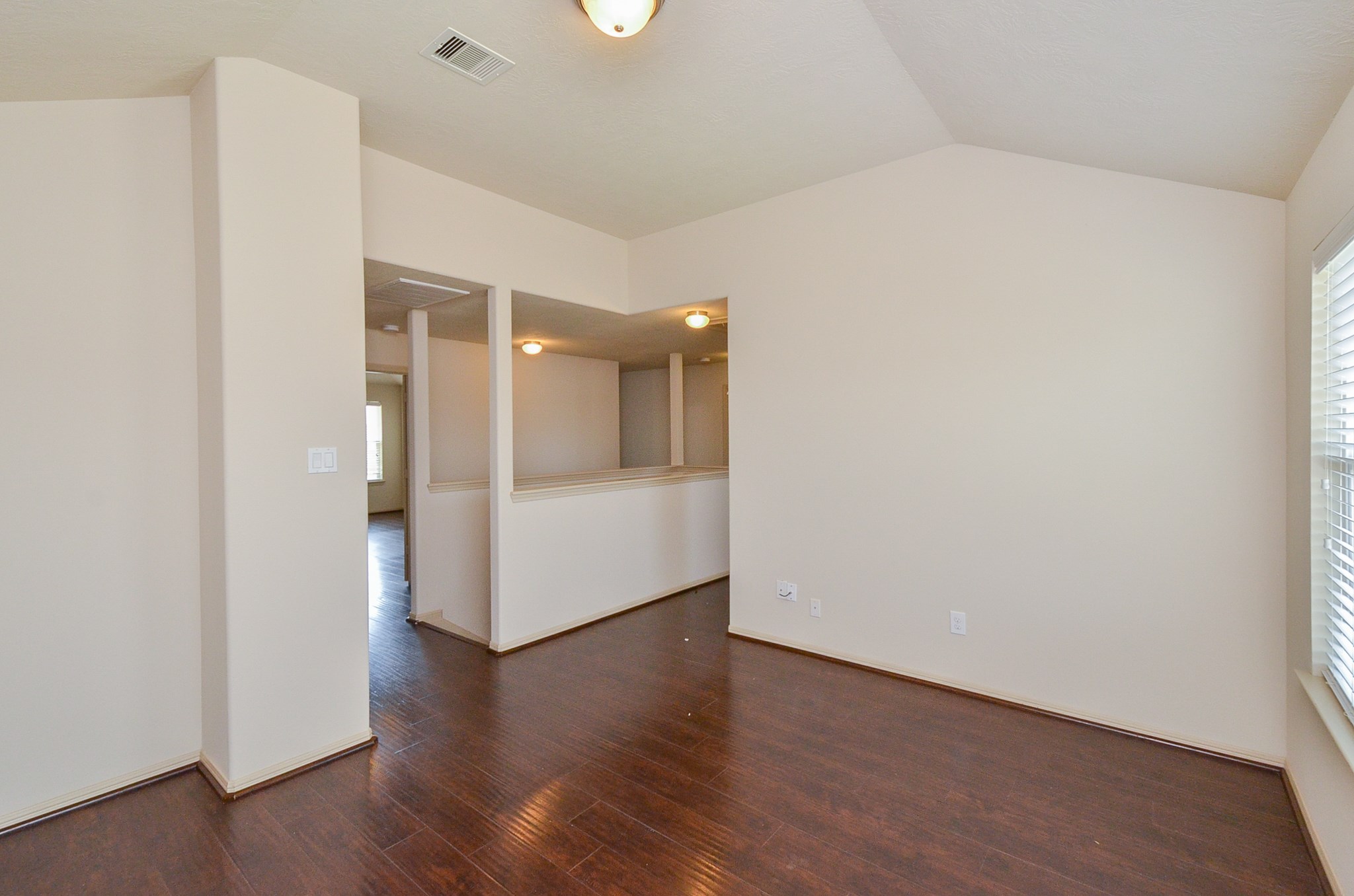 25135 Ginger Ranch Drive Katy, TX 77494 - Photo 16 of 32 Game Room: A bright room with wood-style flooring and vaulted ceilings offers a comfortable and versatile retreat.