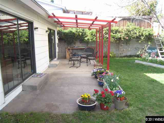 1750 O Farrell Street Reno, NV 89503 - Photo 7 of 13 a view of a chairs and table in a backyard