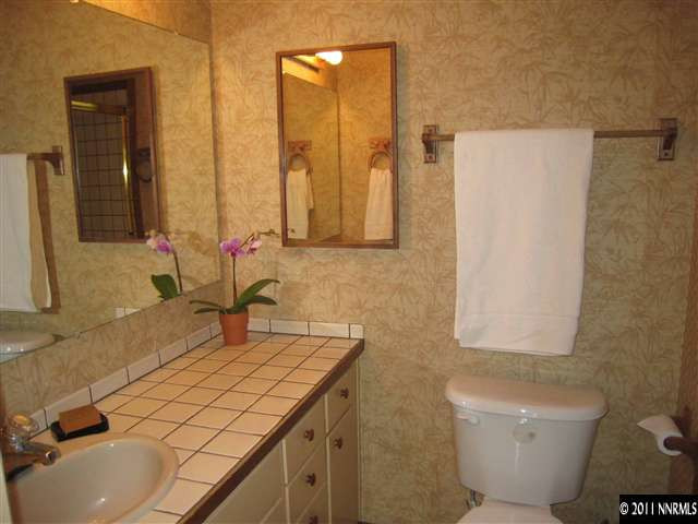 1750 O Farrell Street Reno, NV 89503 - Photo 10 of 13 a bathroom with a sink toilet and mirror