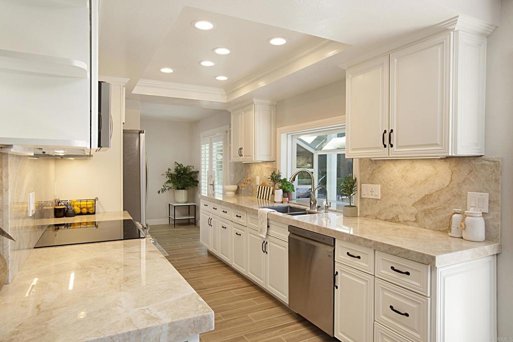 1414 Flair Encinitas Drive Encinitas, CA 92024 - Photo 12 of 39 a kitchen with sink and cabinets