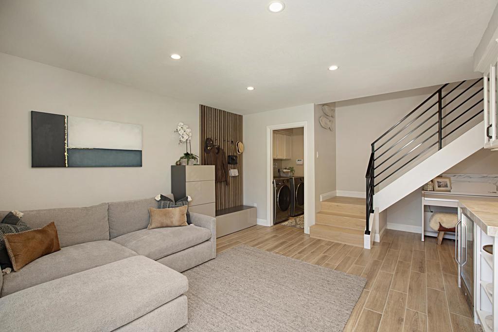 1414 Flair Encinitas Drive Encinitas, CA 92024 - Photo 16 of 39 a living room with furniture and a wooden floor