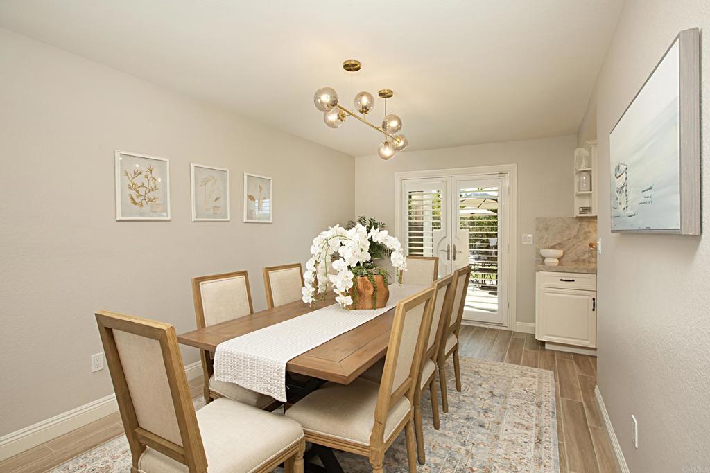 1414 Flair Encinitas Drive Encinitas, CA 92024 - Photo 10 of 39 a dining room with furniture and chandelier