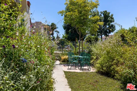 a kitchen with stainless steel appliances a sink and a window
