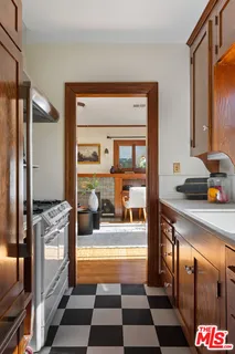 a living room with furniture a rug and a window