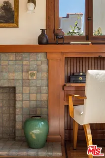 a view of empty room with ceiling fan and window