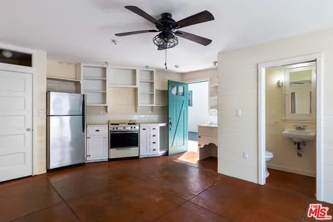 a bathroom with a sink toilet and mirror