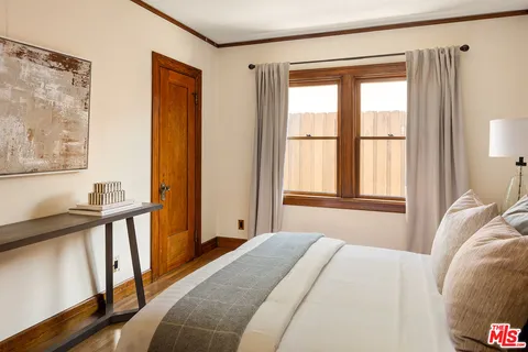 a stove top oven sitting inside of a kitchen