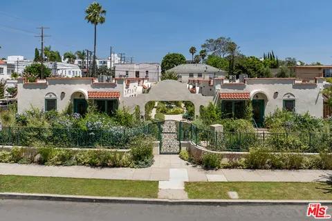 an aerial view of a house with a sign board
