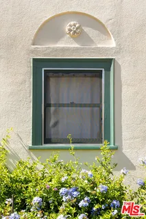 a bathroom with a sink toilet a mirror and shower