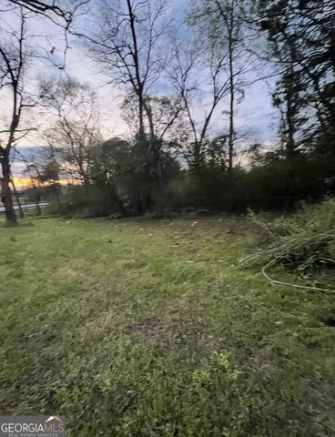a view of a field with an trees