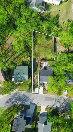 a backyard of a house with a yard and outdoor seating