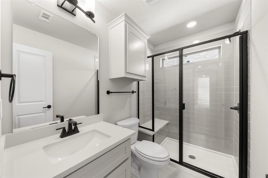 14994 Chipping Trail Frisco, TX 75035 - Photo 35 of 40 a bathroom with a sink toilet and shower