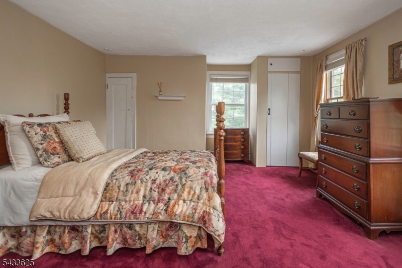449 Stamets Road Milford, NJ 08848 - Photo 30 of 44 a bedroom with a bed and a dresser