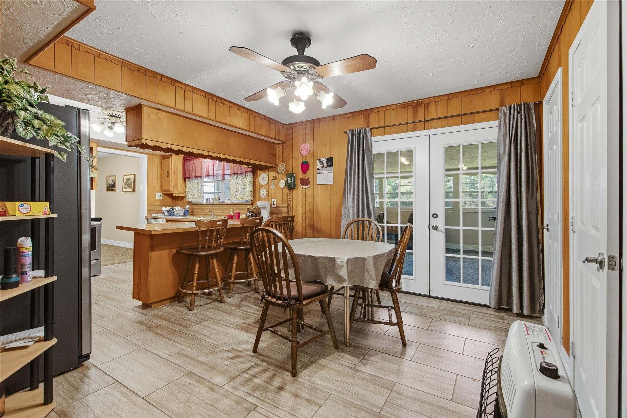 411 County Road 2298 Cleveland, TX 77327 - Photo 17 of 47 a view of a dining room with furniture window and wooden floor