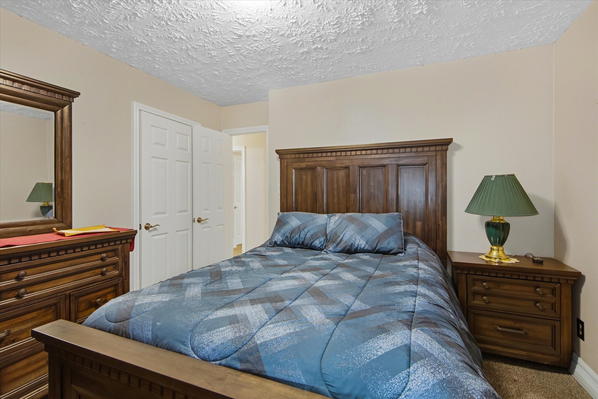 411 County Road 2298 Cleveland, TX 77327 - Photo 31 of 47 a bedroom with a bed and a dresser