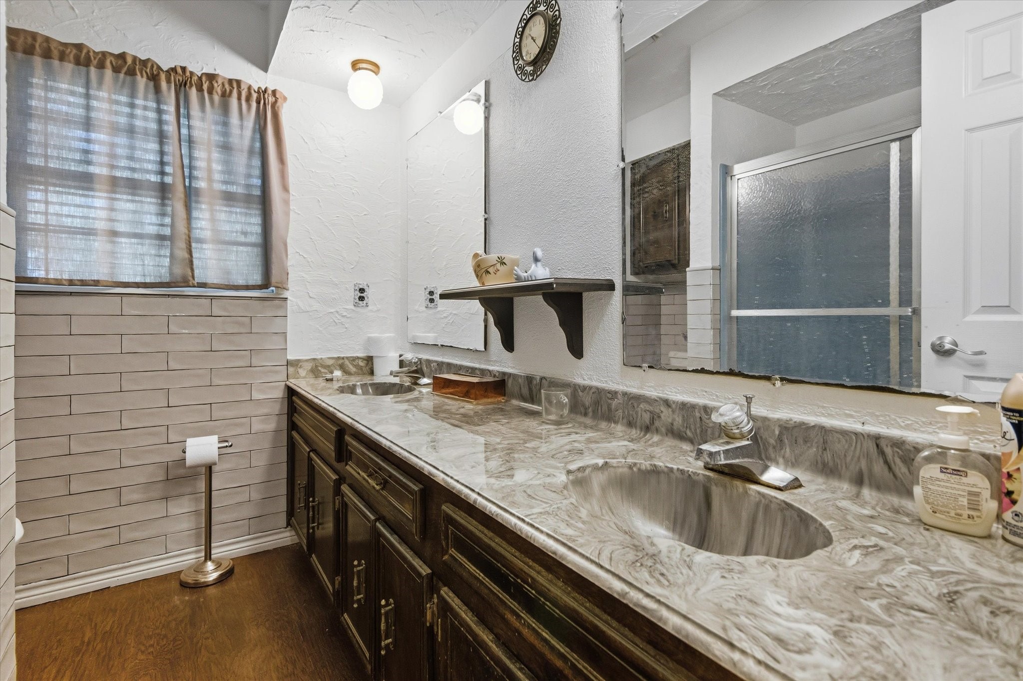 411 County Road 2298 Cleveland, TX 77327 - Photo 32 of 47 a bathroom with a sink and a mirror