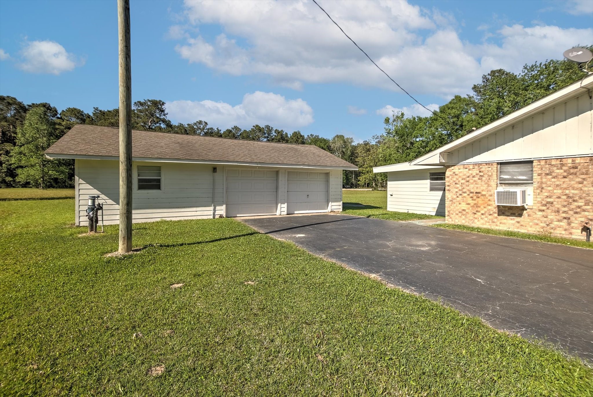 411 County Road 2298 Cleveland, TX 77327 - Photo 36 of 47 a view of a house with a yard