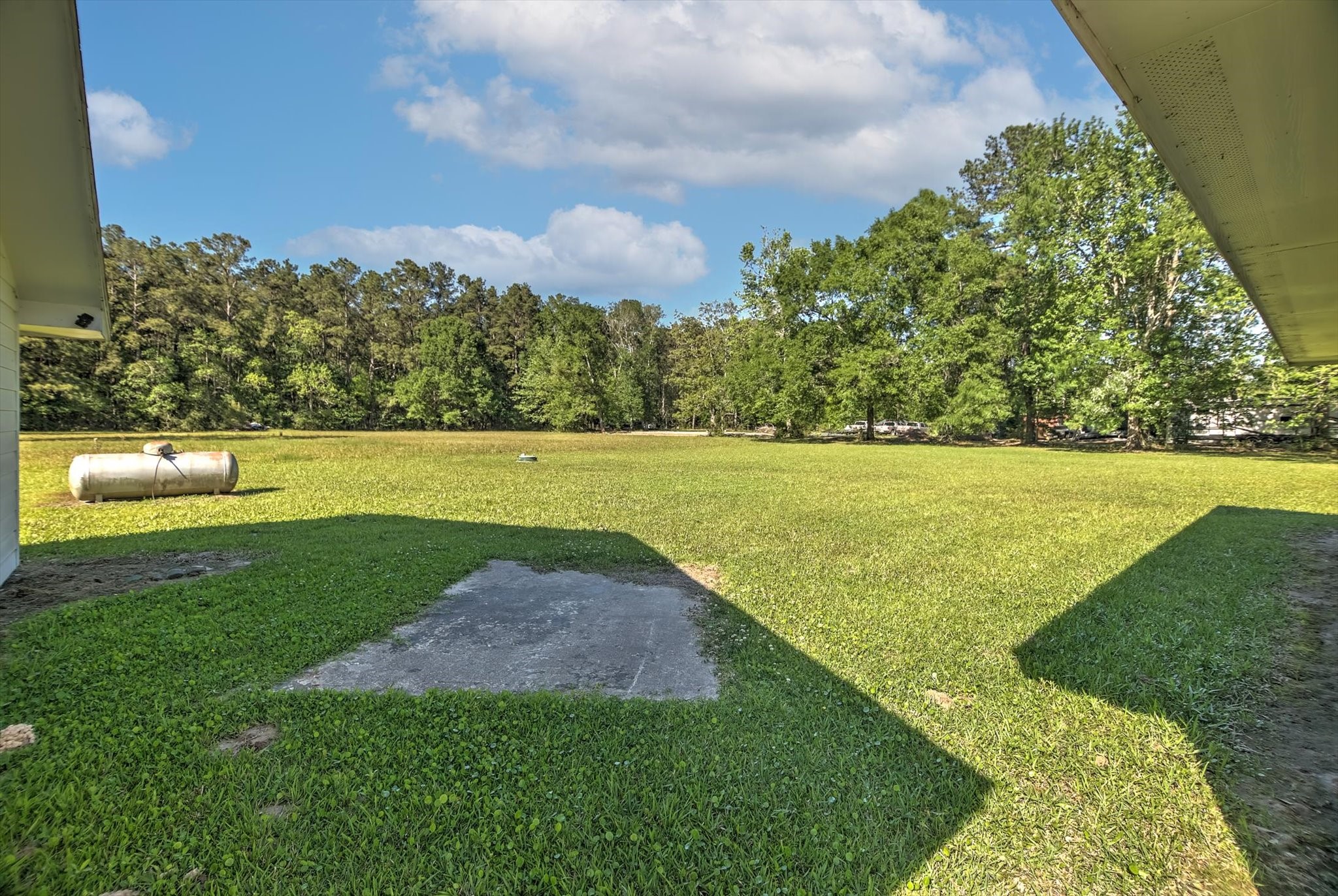 411 County Road 2298 Cleveland, TX 77327 - Photo 37 of 47 a view of a field with an ocean