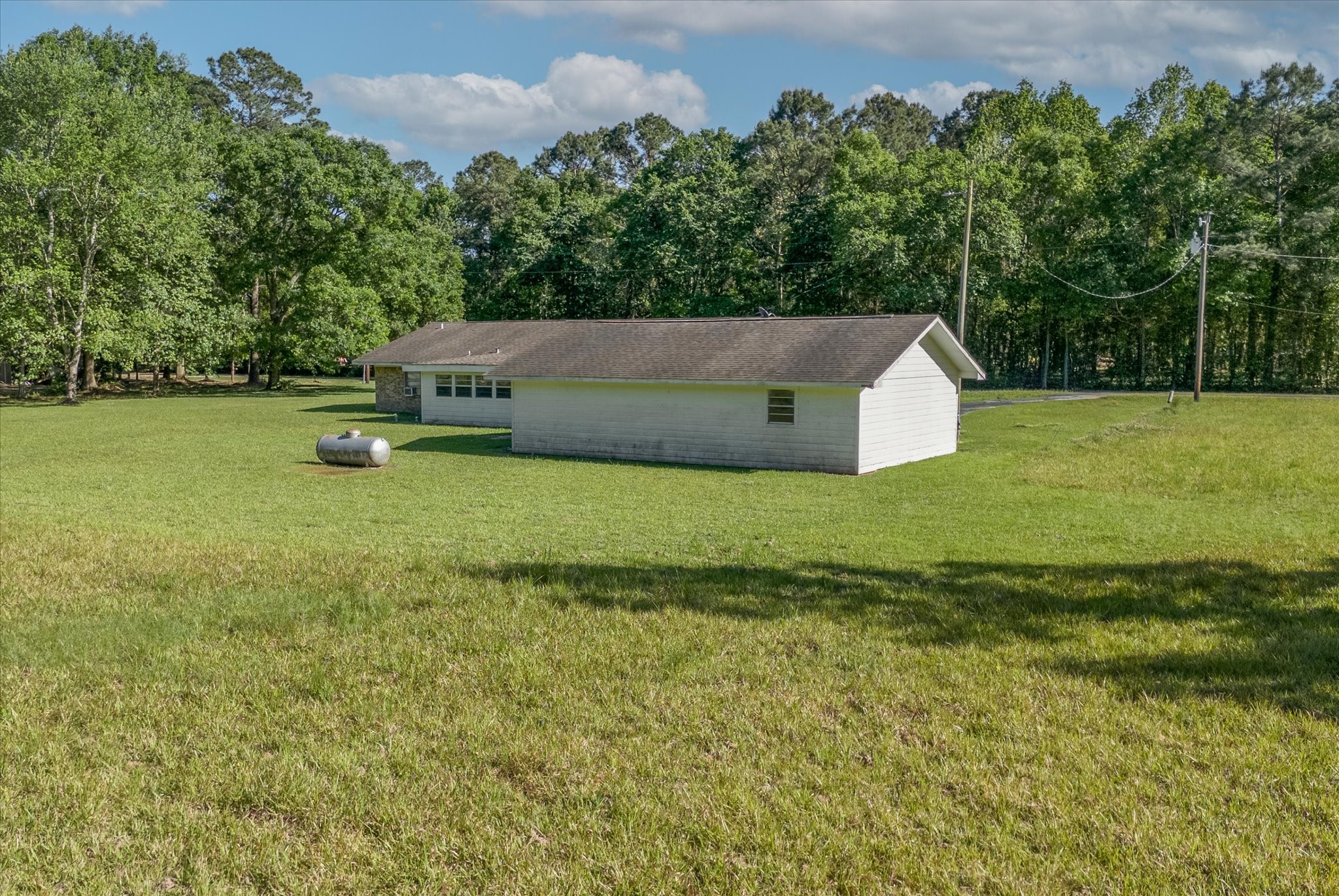 411 County Road 2298 Cleveland, TX 77327 - Photo 40 of 47 a view of a garden and basketball court