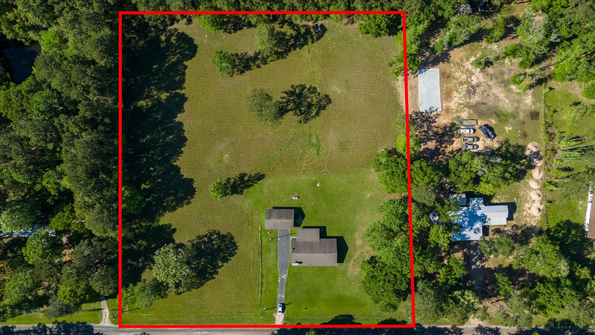411 County Road 2298 Cleveland, TX 77327 - Photo 42 of 47 an aerial view of a residential houses with outdoor space and trees all around
