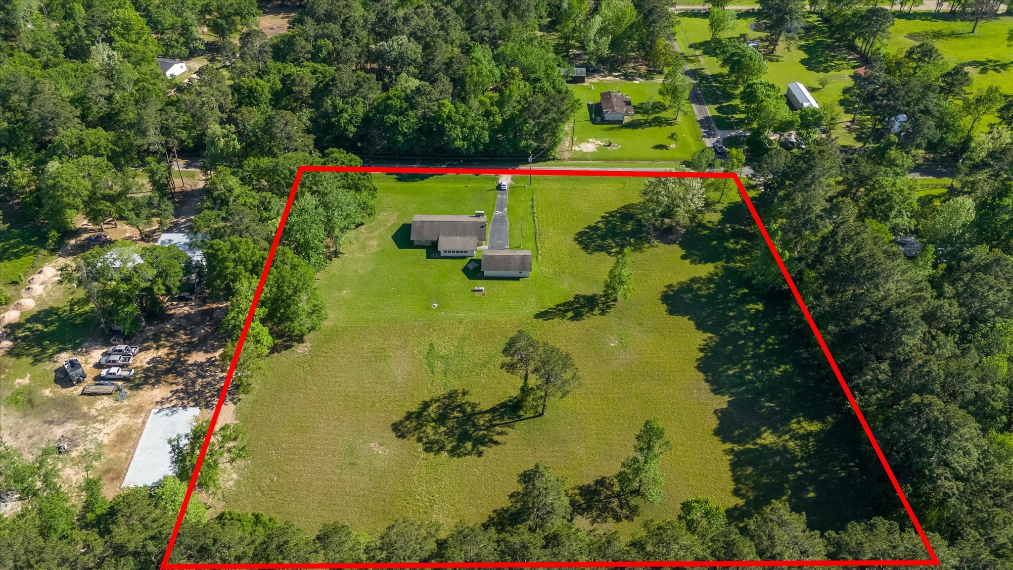 411 County Road 2298 Cleveland, TX 77327 - Photo 44 of 47 an aerial view of a residential houses with swimming pool and outdoor space