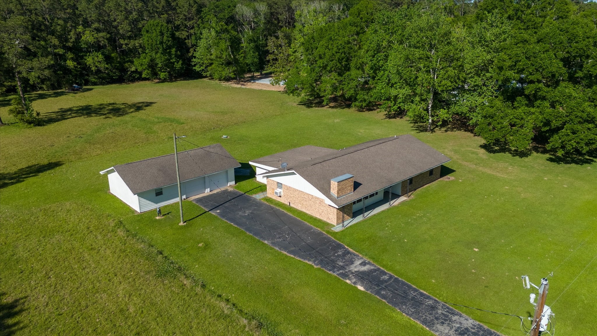 411 County Road 2298 Cleveland, TX 77327 - Photo 47 of 47 an aerial view of a house with a yard