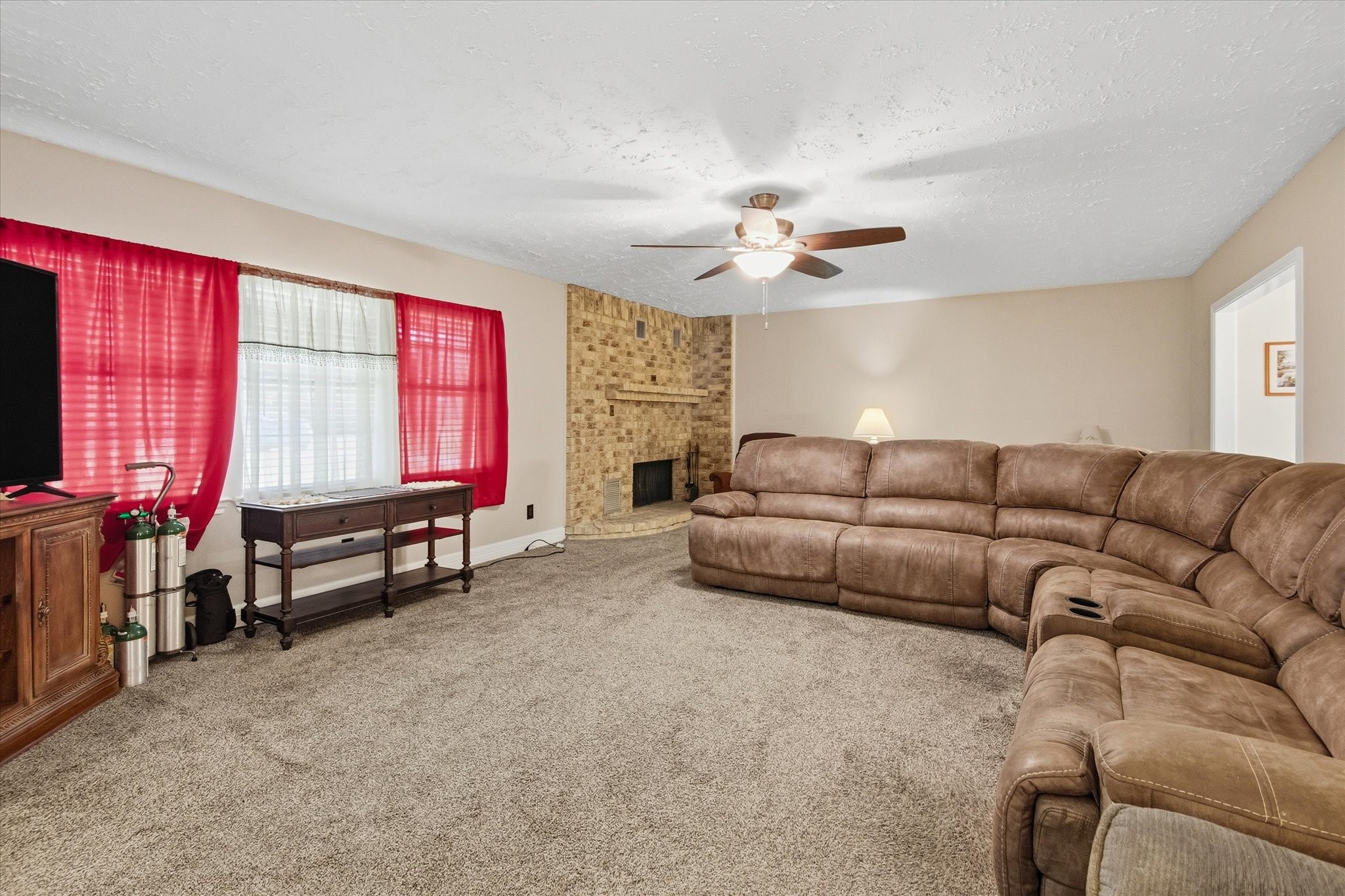 411 County Road 2298 Cleveland, TX 77327 - Photo 6 of 47 a living room with furniture and a flat screen tv