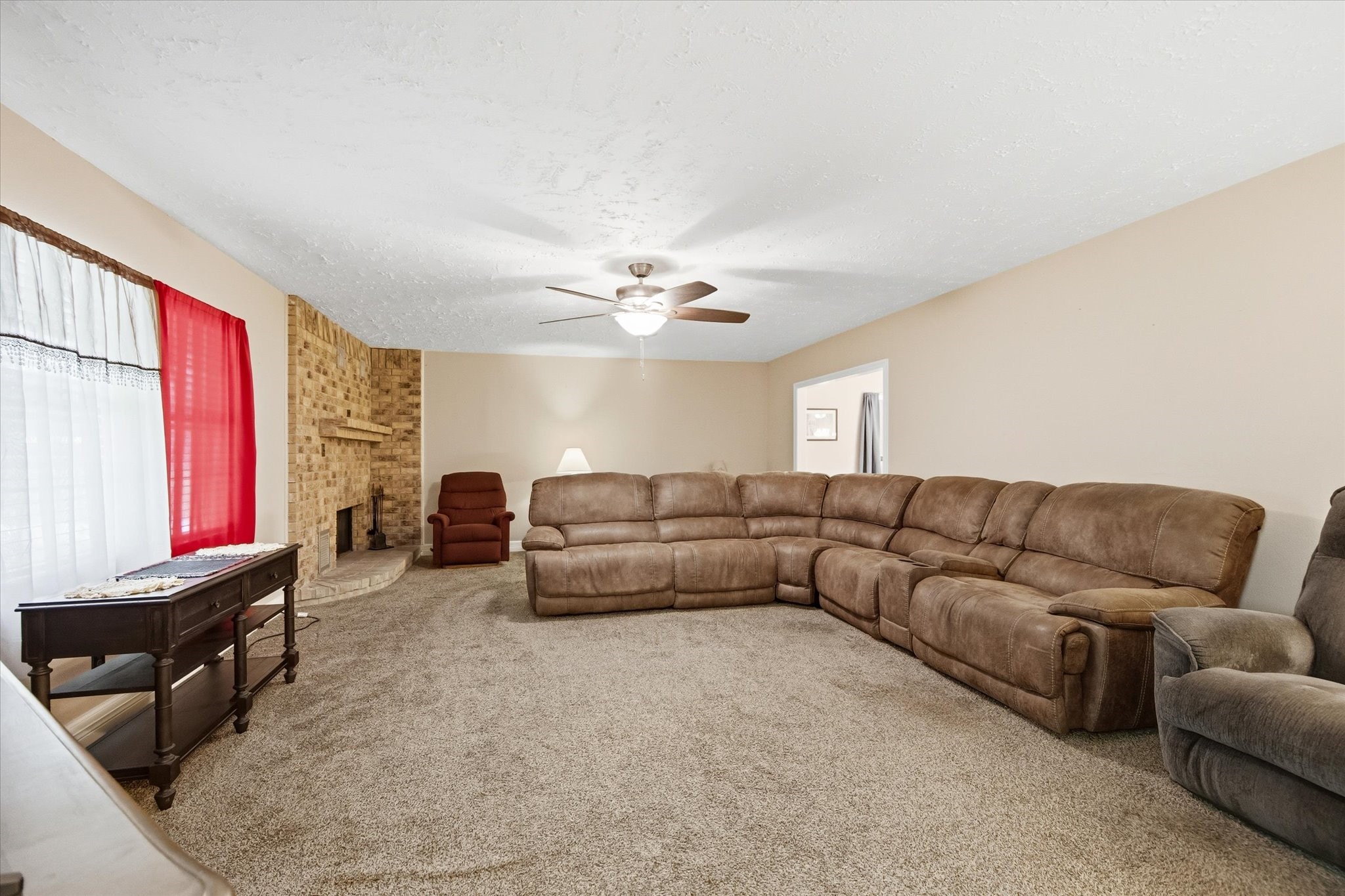 411 County Road 2298 Cleveland, TX 77327 - Photo 7 of 47 a living room with furniture and a flat screen tv
